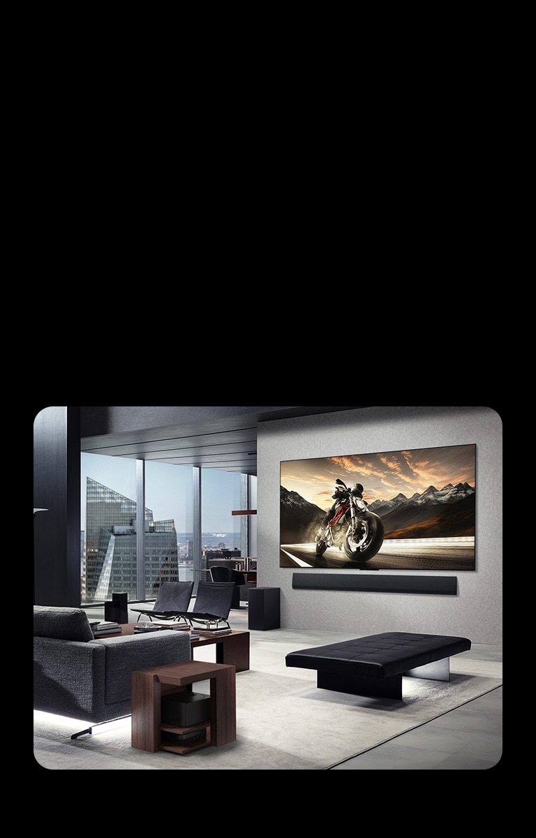LG OLED M4 and LG Soundbar mounted on the living room wall of a high-rise apartment. The layout is clutter-free. The Zero Coonect Box can be seen, hidden underneath a side table by a couch.