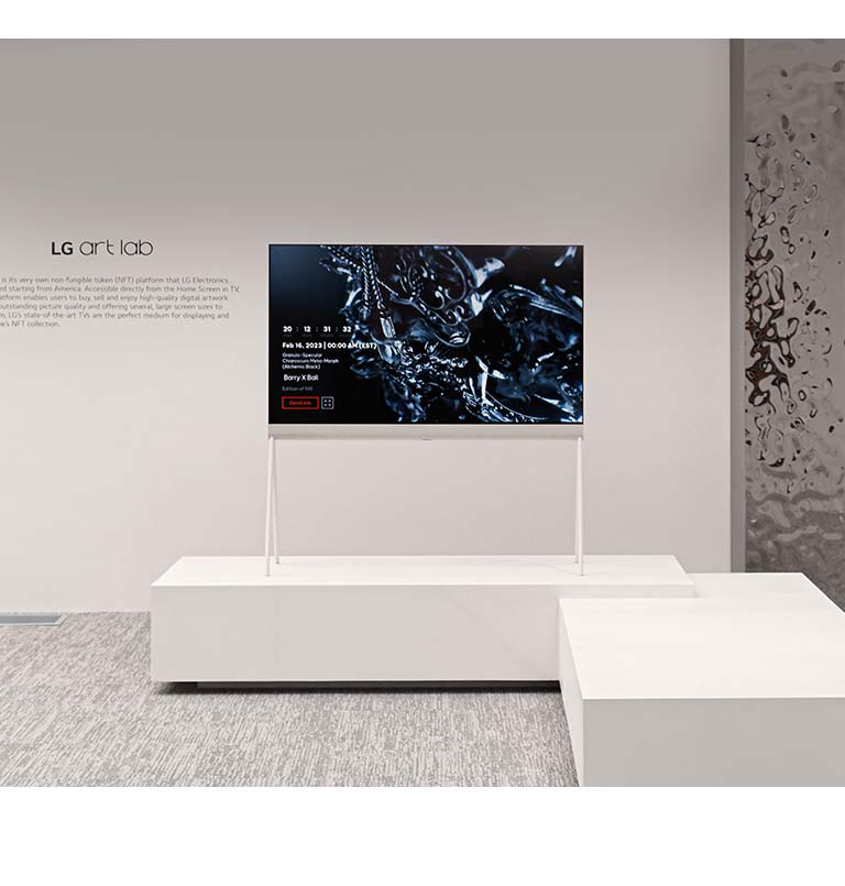 An image of Easel in a white room shows a digital artwork of a black sculpture on screen. A silver physical sculpture on the right-hand side of the TV shows a reflection of the room.