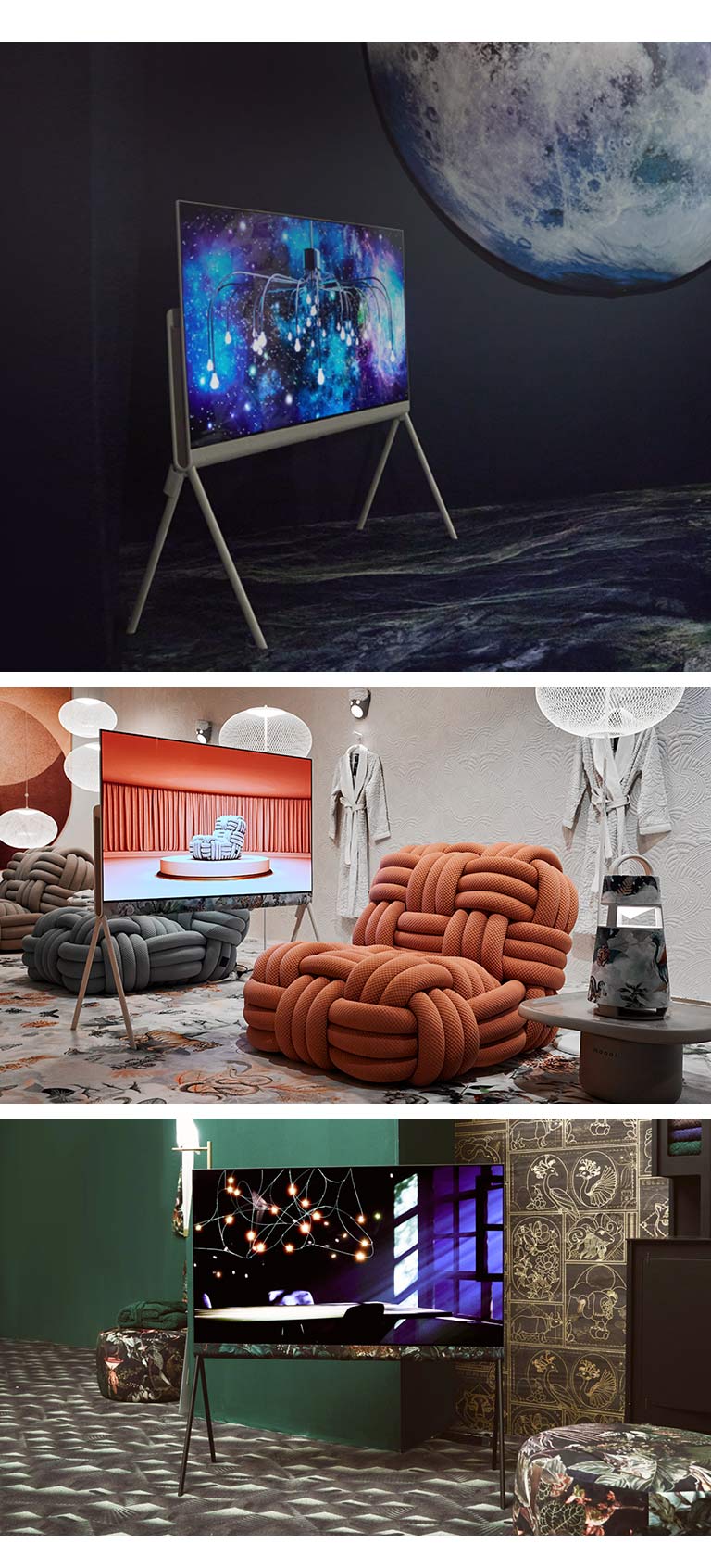 The top image shows Posé in a black space-themed room with an abstract intergalactic artwork on display. The room also has a picture of a moon and an astronaut. 	  The bottom right image shows Posé in an opulent emerald green room. The TV shows light casting over a table through windowpanes on the screen. The room also features black and gold ornate tiles and black floral patterned textile stools. The bottom left image shows Posé in a cream room with hints of colors. The room has terracotta and charcoal-colored chunky woven sofa chairs, white ball-shaped light fixtures, and bathing robes hanging on the wall. The TV shows an image of the same charcoal sofa chair on a platform in a terracotta-colored room.