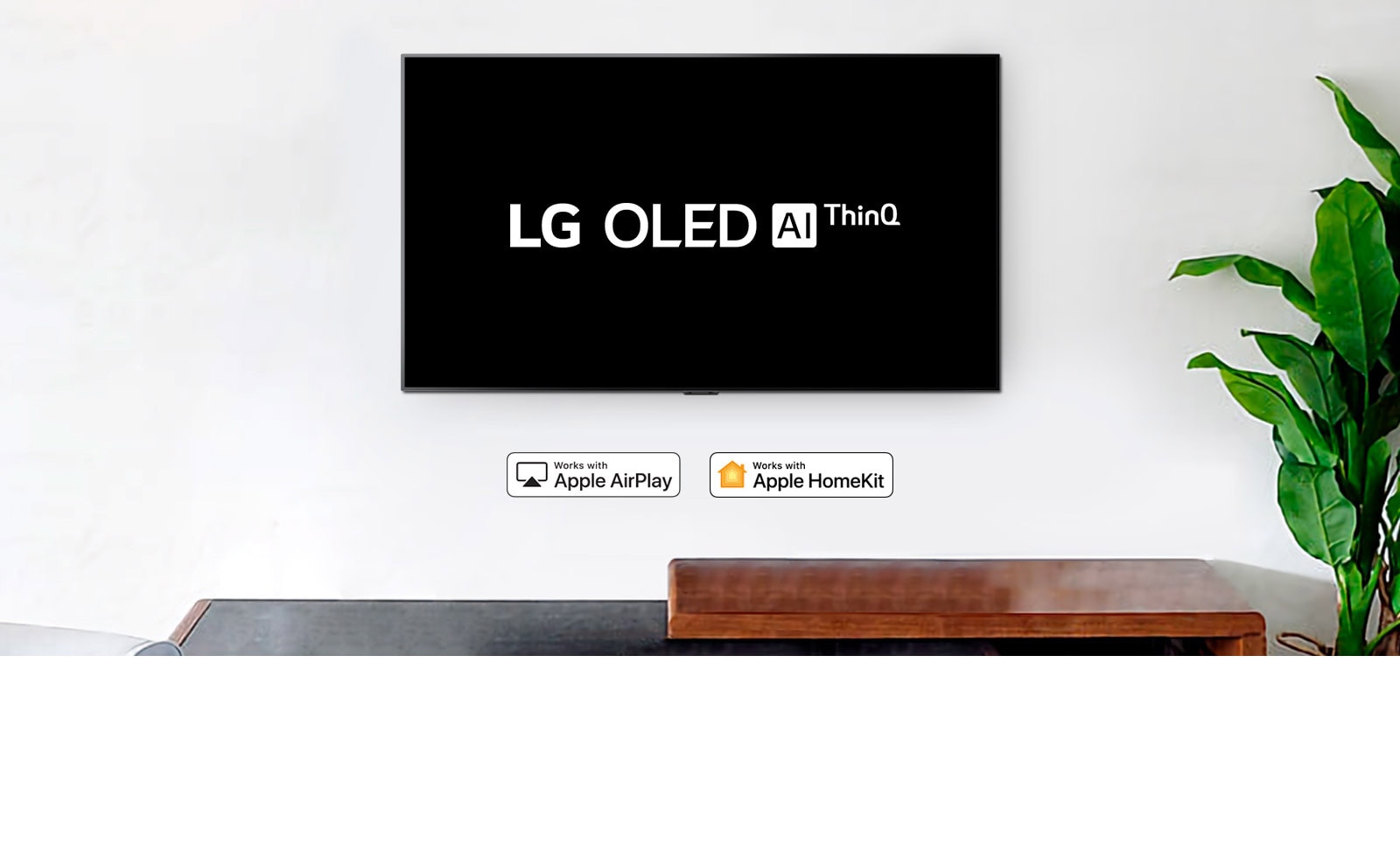 Wall-mounted TV showing LG OLED AI ThinQ logo on black background