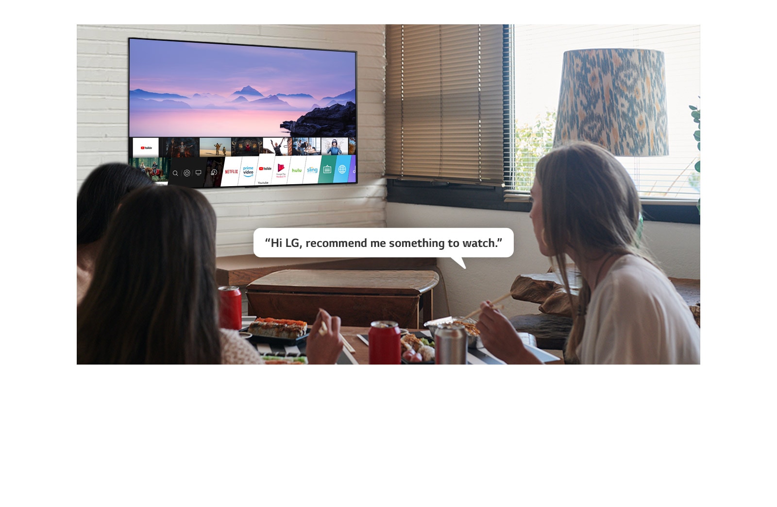 Three woman eating sushi while one of them asks LG TV recommendations to watch