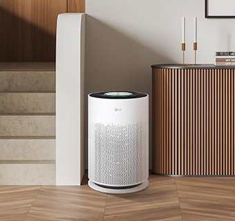 The PuriCare air purifier is placed between the stairs and the drawer.