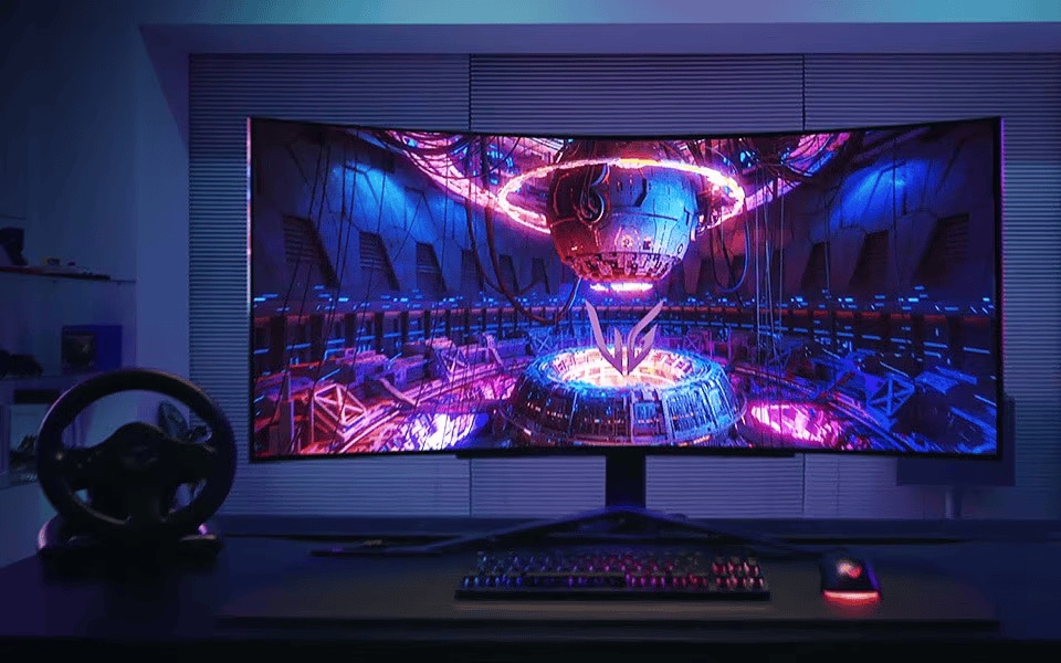 Curved gaming monitor displaying a vibrant sci?fi scene with neon lights, keyboard and mouse on desk.