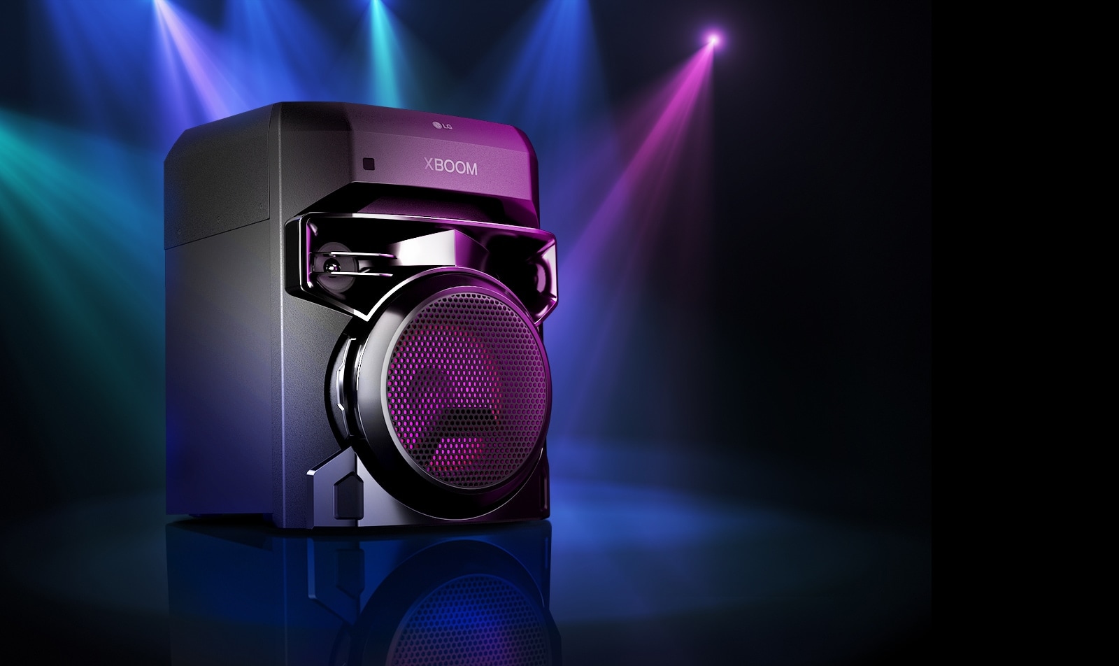 LG XL2S Left 30 degree view of LG XBOOM XL2S spotlighted on the stage. The XBOOM light are also purple. 