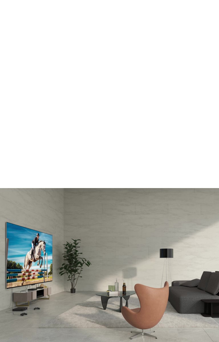 LG OLED evo M4 montuojamas ant sienos, o prietaisai prie televizoriaus prijungiami netvarkingais laidais i? apa?ios. Per vaizd? eina balta grafin? linija, prietaisai i?nyksta ir ant nedidelio stalo pasirodo ?Zero Connect Box“. Vaizdas trumpam patams?ja ir pary?kinami tik televizorius ir ?Zero Connect Box“. Viskas i?nyksta, tada TV ir ?Zero Connect Box“ v?l pasirodo pary?kinti skirtingose vietose. Vaizdas v?l pa?vies?ja.