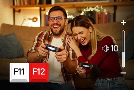 Acima da tela de cinema, os ícones de teclado F11 e F12 s?o exibidos e uma tela mostrando o aumento do volume está sendo reproduzida.