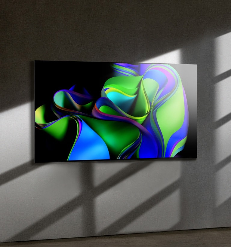 Um vídeo come?a com as palavras LG OLED em fonte branca contra fundo preto. As palavras aumentam e se enchem de cor. Em seguida, a cena muda para LG OLED G3, mostrando uma arte abstrata colorida. A tela gira para o lado para apresentar a borda fina, depois fixa-se em uma parede para representar o Design One Wall.