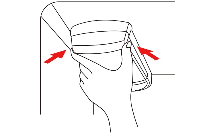 Hand adjusting a glass shelf in a refrigerator, following red arrows for correct placement.