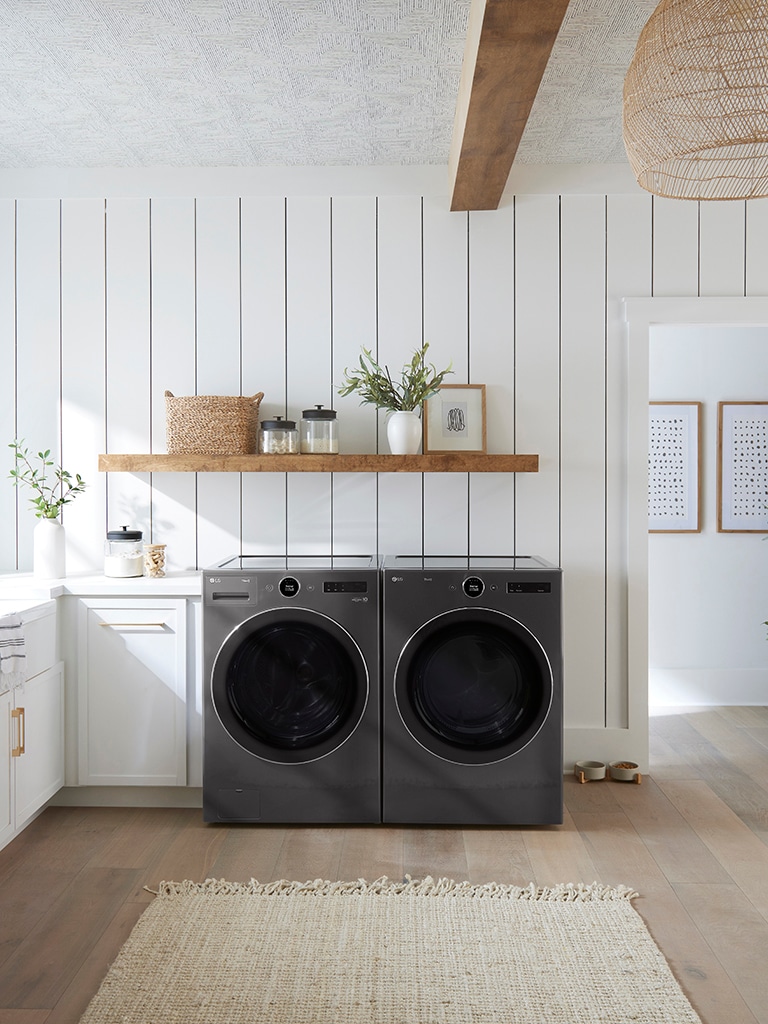 This is an image of a washing machine placed in a laundry room.