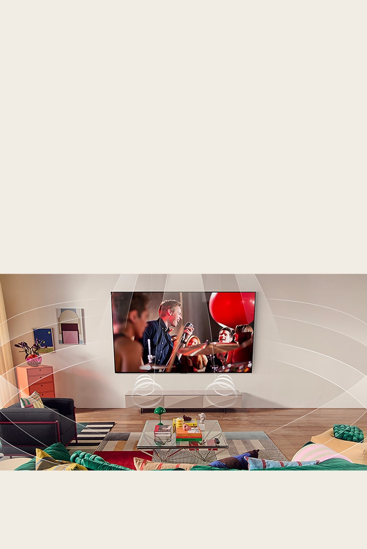 Salon équipe d’un LG TV fixé au mur. Les ondes sonores sont représentées graphiquement pour remplir l’espace et montrer comment les cha?nes virtuelles 9.1.2 créent une expérience de son multicanal pour l’utilisateur. 