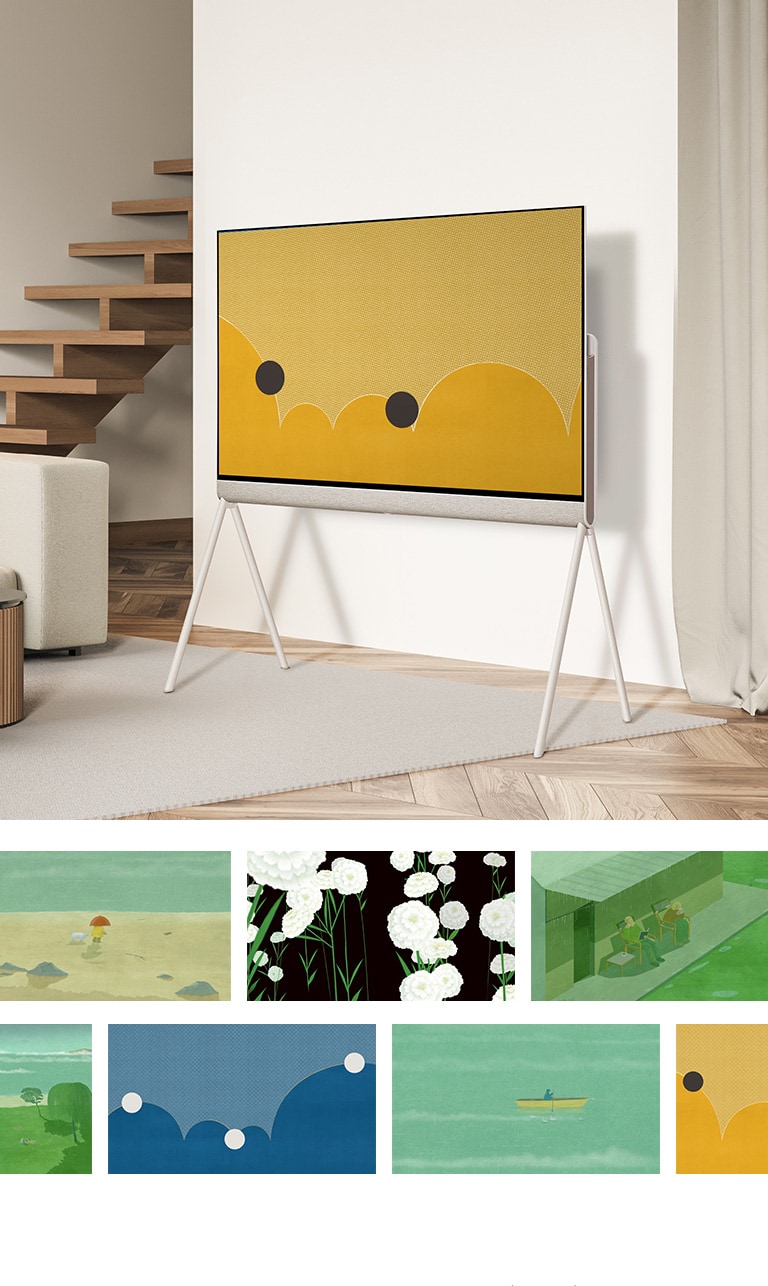 Posé-Ansicht in einem Wohnzimmer mit Kunstwerk in kr?ftigem Blau und orangefarbenen Kreisen auf dem Bildschirm, die Kreise springen auf, wenn das Kunstwerk von Blau in Senfgelb wechselt. Weiter unten finden Sie eine Auswahl von Kunstwerken, wie: Paar sitzt im Freien, wei?e Nelken, Kind und Hund an einem felsigen Strand, abstraktes Kunstwerk in kr?ftigem Blau, Auto mit angeschaltetem Licht unter einem Baum, schwarzes abstraktes Kunstwerk, wei?e Narzissen und ihr Schatten, abstraktes Kunstwerk in kühlem Blau, Person rudert in einem Boot auf dem Meer, abstraktes Kunstwerk in Senfgelb, Haus an der Küste und Sprossen auf Baum?sten.