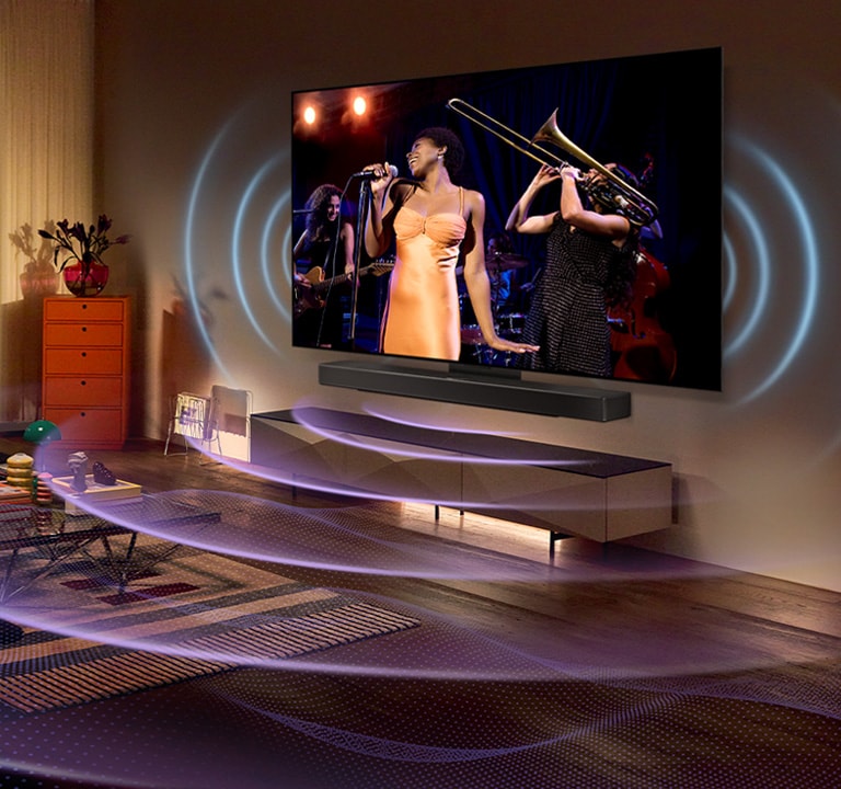 Obrázek místnosti s?televizorem LG OLED s?hudebním koncertem na obrazovce. Prostor vyplňují modré k?ivky znázorňující zvuk televizoru a?fialové k?ivky znázorňující zvuk soundbaru.