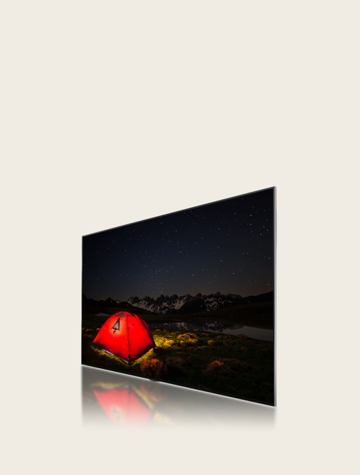 Vista en ángulo lateral de un televisor LG que muestra una imagen apagada y borrosa de una tienda de campa?a por la noche. Una capa del televisor se desplaza hacia atrás mostrando grandes zonas de atenuación y, a continuación, zonas de atenuación azules más peque?as se desplazan para sustituirlas. La capa avanza para volver a conectarse al televisor LG, entonces la imagen de la carpa se vuelve más brillante y clara.