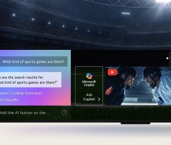 Nahaufnahme eines LG QNED TV-Bildschirms, der zeigt, wie AI Search funktioniert. Ein kleines Chat-Fenster ist ge?ffnet und zeigt, wie der Benutzer nachfragt, welche Sportspiele verfügbar sind. AI Search antwortete per Chat und zeigte Vorschaubilder verfügbarer Inhalte an. Es wird auch eine Aufforderung mit einer Frage an Microsoft Copilot angezeigt.