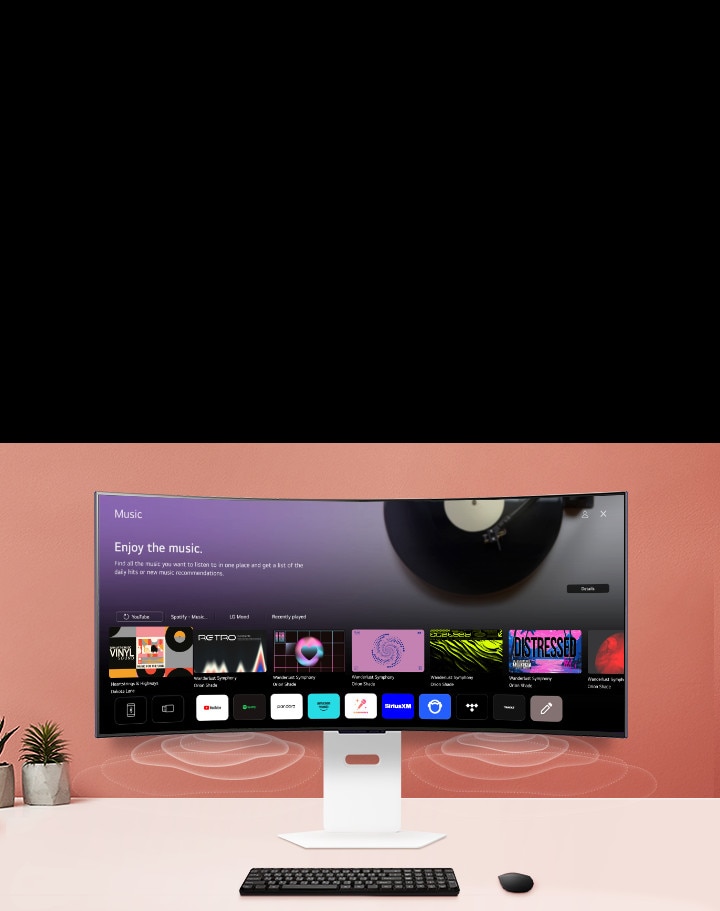 Der intelligente Monitor auf dem Tisch zeigt den Bildschirm der MUSIK APP an.	