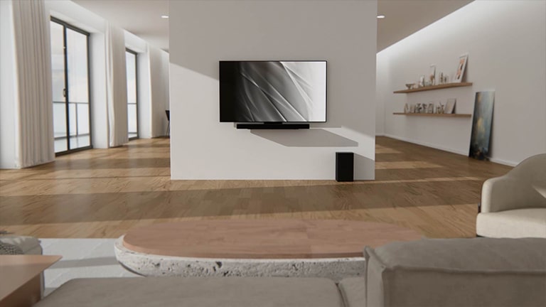 Ein Video zeigt, wie das Matching-Kit in die Rückseite des LG OLED evo TV C3 geschraubt wird. Der Fernseher l?sst sich dann nahtlos an der Wand eines hellen, modernen Wohnraums befestigen.