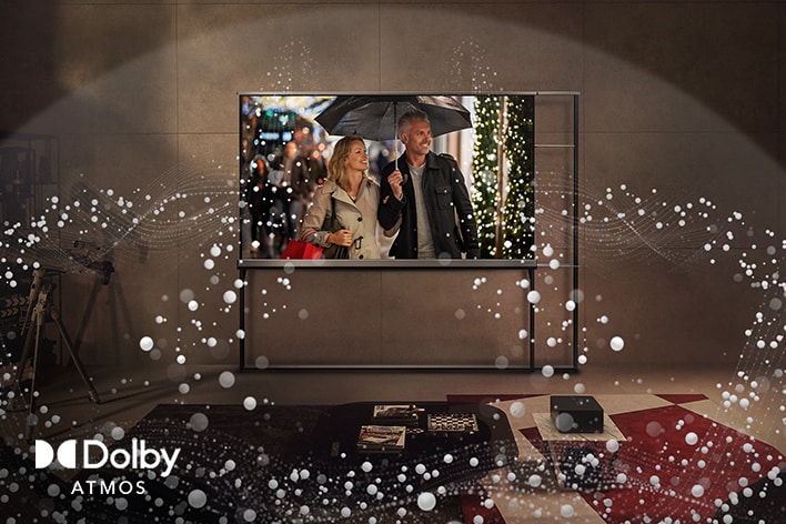 Ein LG OLED-Fernseher an einer Wohnzimmerwand und abstrakte Kreise, die vom Fernseher ausgehen und den Raum ausfüllen.
