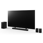 Vue inclinée de LG QNED 190?cm, de la LG Soundbar S75TR et du caisson de basse