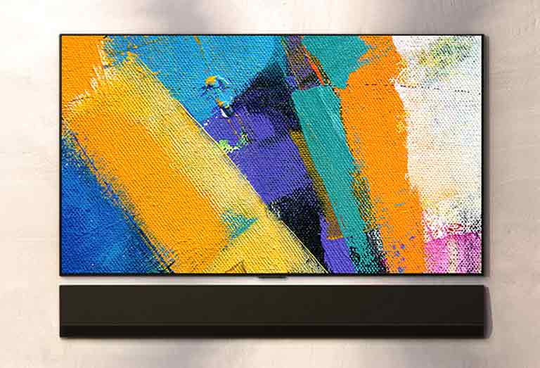 La barre de son murale LG et le téléviseur LG sont présentés sous trois angles. Différentes couleurs de peinture sont affichées sur l'écran du téléviseur.