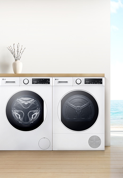 Lave-linge et sèche-linge installés c?te-à-c?te.