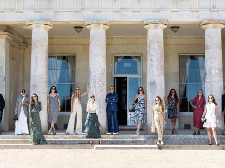 Stylish models try to recreate an iconic photo from the 1800s on the front steps of Goodwood House.