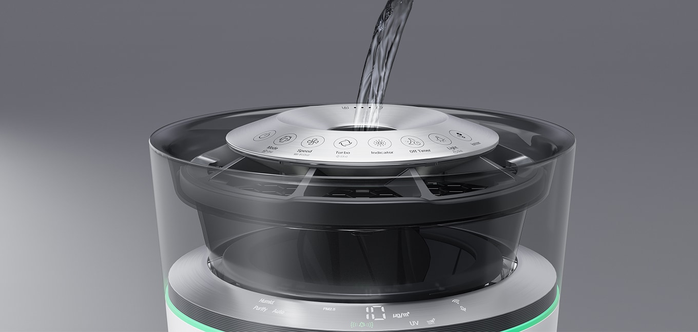 Water being poured into the opening on the top of the Air Purifier. 