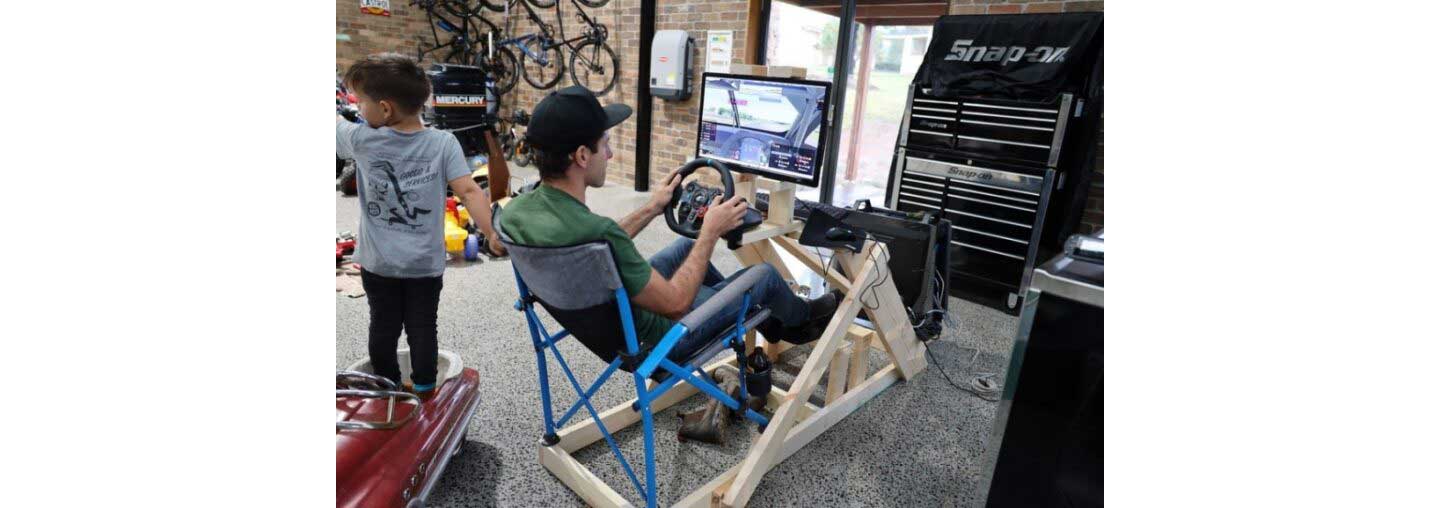 Rick Kelly, a supercar racer, experiencing his beloved sport online with his homemade racing simulator