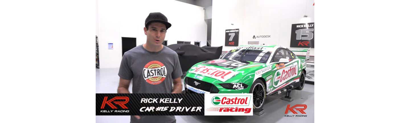 Racing driver Rick Kelly being interviewed in front of his green Ford Mustang GT