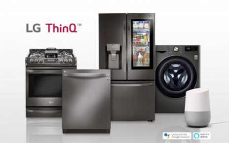 LG smart appliances lineup including refrigerator, front-load washing machine, oven and dishwasher with the SmartThinQ? logo on the upper left. Google Home, an AI speaker with Google Assistant standing along with LG smart appliances.