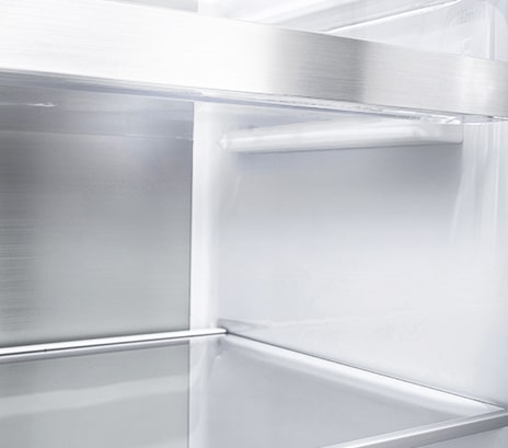 A diagonal view of the shelf with metallic paneling on the interior of the refrigerator.