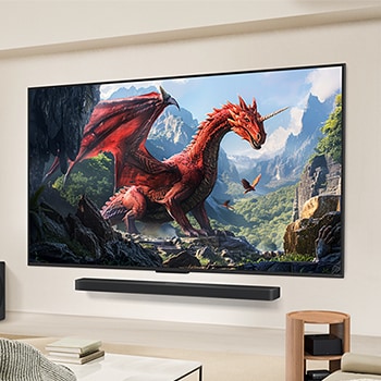 A family sits on a couch facing a LG QNED TV mounted on a wall above a LG Soundbar. Zero Connect Box sits inside a coffee table.