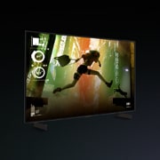 An LG C4 42 inch TV in a dark space on a two-pole stand shows colorful gameplay on the screen.