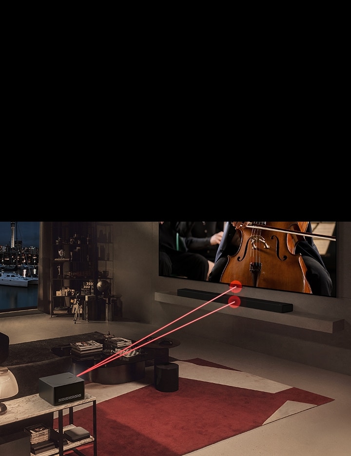 En la pantalla del LG SIGNATURE OLED M4 se reproduce un concierto y delante hay una Zero Connect Box. Aparece una se?al de Wi-Fi roja sobre Zero Connect Box y se emiten dos rayos de luz roja hacia el televisor y la barra de sonido LG.