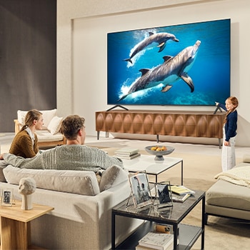 Sci-fi content is playing on an LG QNED TV screen. On the screen is the AI Chatbot interface. The user messaged the chatbot saying that the screen is too dark. The chatbot offered solutions to the request. The 