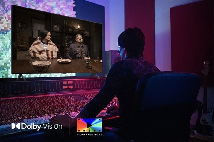 A director in front of a control panel editing the movie "Killers of the Flower Moon" on an LG QNED TV. In the bottom left, the Dolby Vision logo and FILMMAKER MODE? logo.