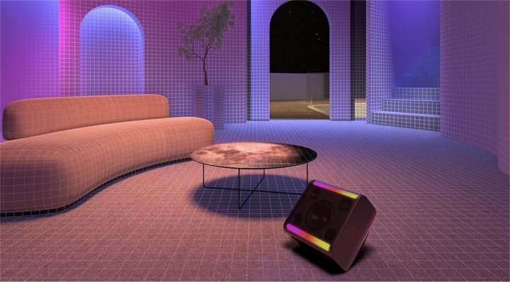 Trong m?t c?n phòng có gh? sofa dài, bàn tròn và cay xanh, xboom Stage 301 ???c ??t lên phía tr??c v?i ?èn b?t sáng.