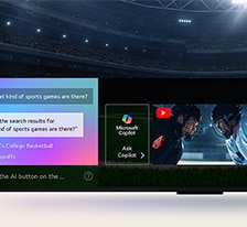 Zbli?enie ekranu LG QNED TV, pokazuj?ce dzia?anie funkcji AI Search. Otwarte zostanie ma?e okno czatu informuj?ce o tym, ?e u?ytkownik zapyta? o dost?pne gry sportowe. Wyszukiwanie AI udzieli?o odpowiedzi za po?rednictwem czatu i wy?wietlaj?c miniatury dost?pnych tre?ci. Pojawia si? równie? monit umo?liwiaj?cy zadanie pytania Microsoft Copilot. 