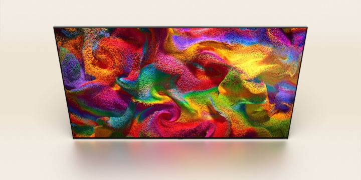 Partículas coloridas irrompem no ecr?, depois os píxeis mudam lentamente para uma imagem aproximada de uma parede pintada com um padr?o colorido no ecr? da LG TV.