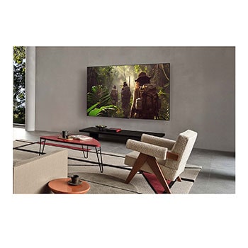 LG AI Magic Remote med AI-knappen markerad. Runt den visas de olika funktionerna som en anv?ndare kan komma ?t fr?n knappen. AI Voice ID, AI Search, AI Chatbot, AI Concierge, AI Picture Wizard, AI Sound Wizard. Texten f?rklarar att LG AI Magic Remote kompletterar din AI-upplevelse med en dedikerad AI-knapp och kan anv?ndas som en virtuell mus. Peka och klicka.