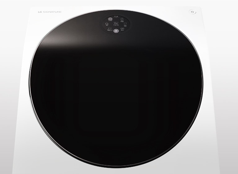 Tv?ttmaskinen LG SIGNATURE placeras i mitten av bilden med en vit bakgrund.