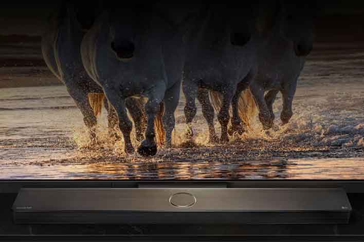 LG TV with LG OLED evo AI 2025 and the World's No. 1 OLED TV for 12 years emblem on its screen. Beside it are wrapped gifts.	