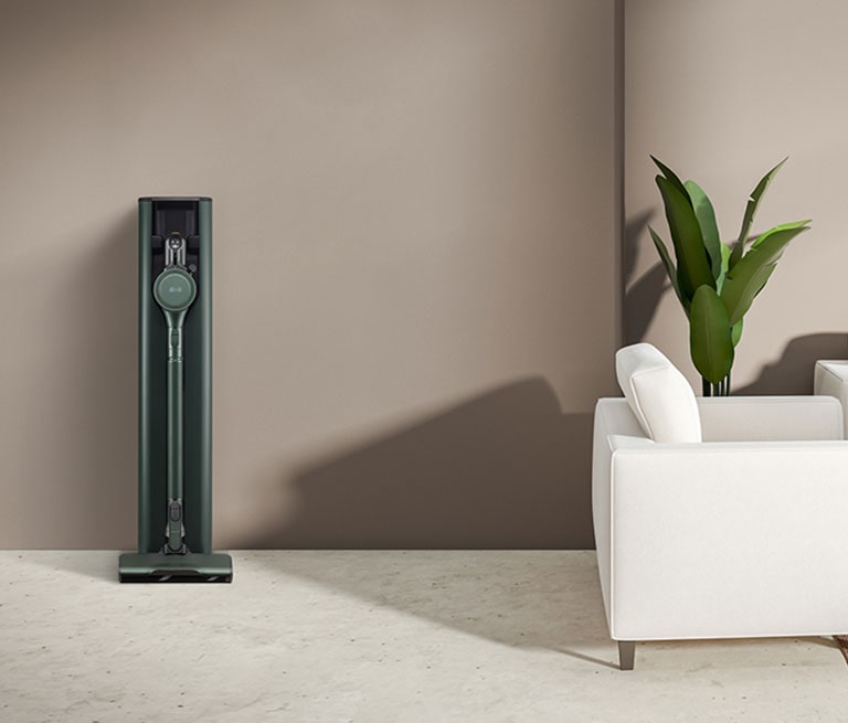 LG CordZero All-in-One Tower Objet Collection is placed in a brown-tone modern living room.