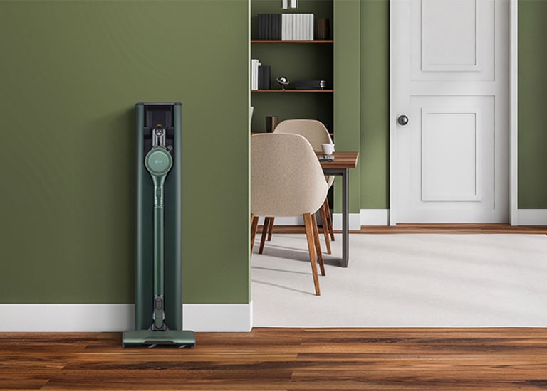 It shows LG CordZero All-in-One Tower Objet Collection is placed in a green-tone modern living room.