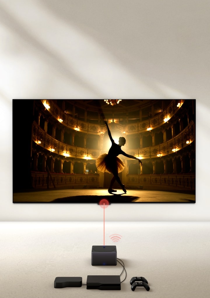 LG SIGNATURE OLED M4 from a high angle in a dark space illuminated by a spotlight, with multiple consoles and devices connected to it by wires that look messy before fading away. Zero Connect Box fades in with neatly organised devices and consoles behind it, a red Wi-Fi signal appears and a red beam emits towards the TV as the perspective swings down to show a full view of the TV.