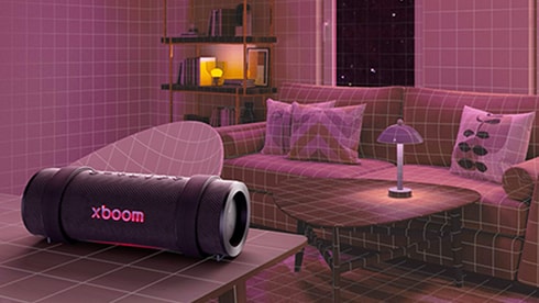 LG XBOOM 擺放在客廳茶幾上，周圍環繞著家具。