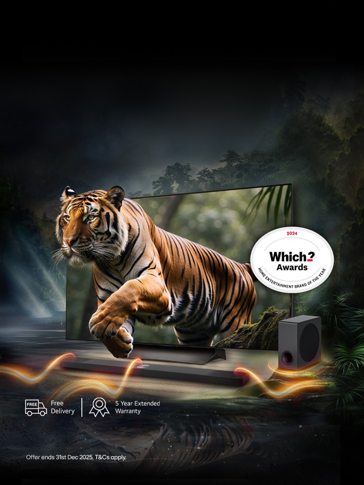 lg tv and a soundbar amd subwoofer on a black background with a bengal tyger jumpin out of the screen to represent to realism of the tv picture