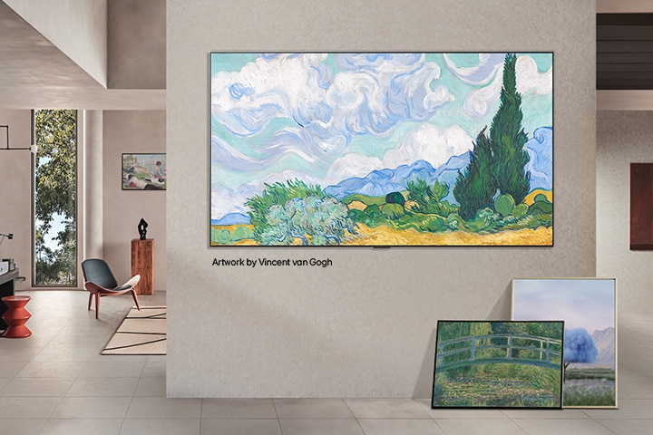 Interior of a sophisticated home. Lots of different artworks are displayed. On the center wall is an LG TV with popular artwork on the screen. The TV looks like a painting from a museum. 	