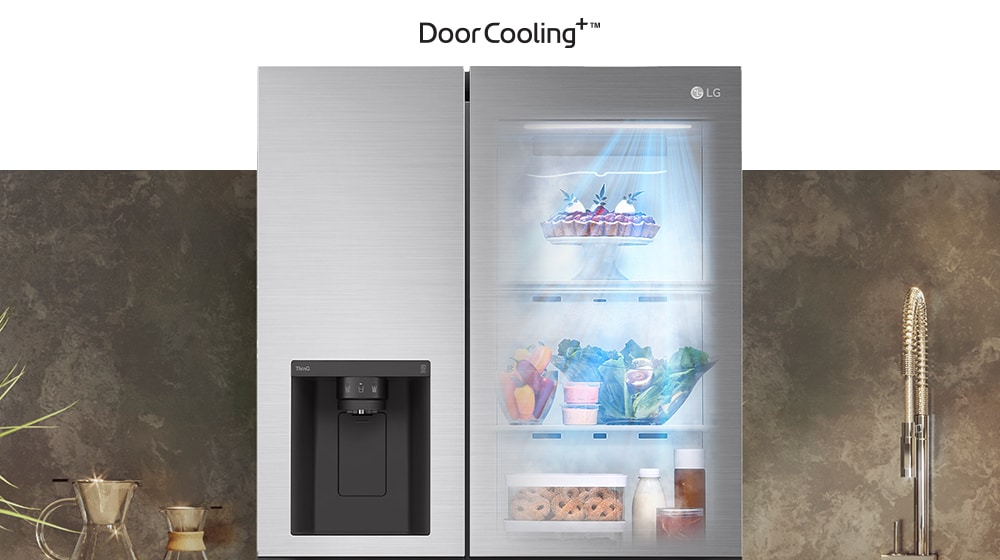 LG side-by-side fridge with DoorCooling+ technology, interior with food and drinks, located next to a sink.