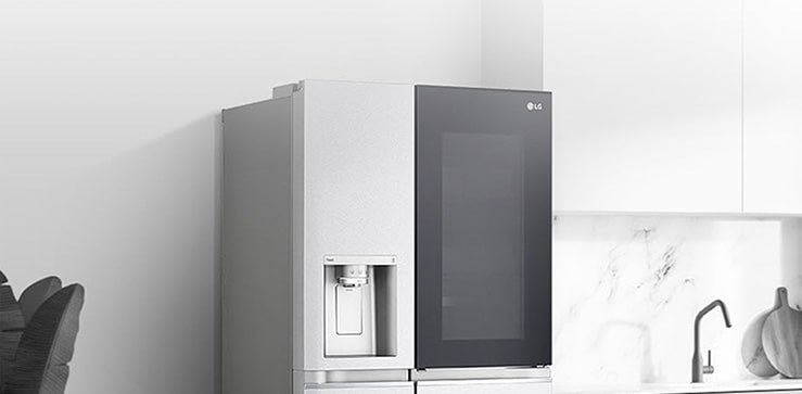A side view of a kitchen with a black InstaView refrigerator installed.
