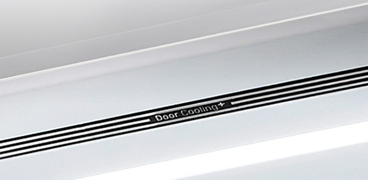 A diagonal view up into the top of the refrigerator showing the soft LED lighting.